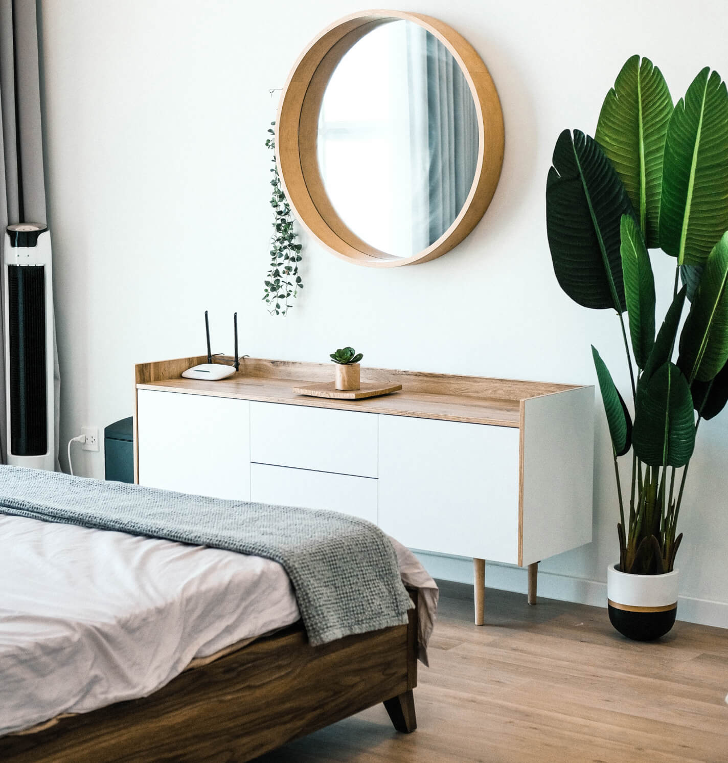 White Bedroom With Green Plant